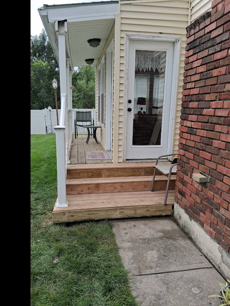 Completed wooden porch viewed from the walkway