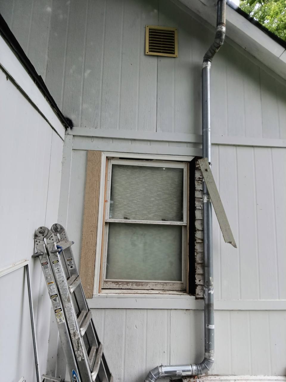 New exterior window trim installation in progress